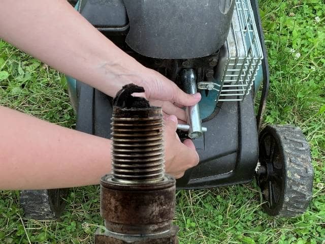 changing spark plug on lawn mower